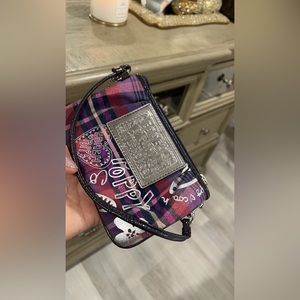 Coach wrist handbag.